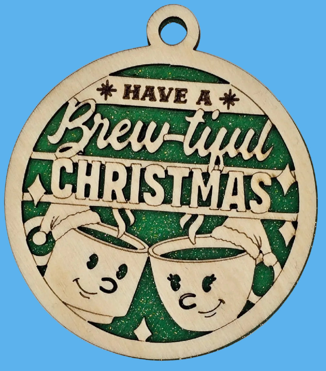 Decorative Christmas ornament with 'Have a Brew-tiful Christmas' text and two cartoon beer mugs on a green background.