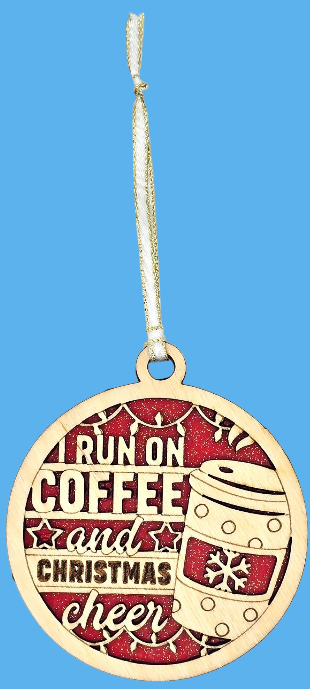 Decorative ornament with 'I run on coffee and Christmas cheer' text and a coffee cup design.