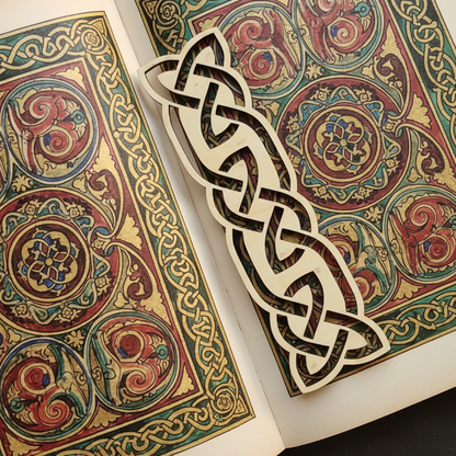 Decorative book with Celtic knot design on a dark background
