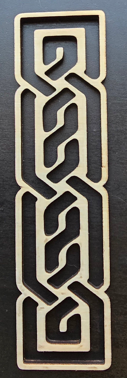 A laser engraved wooden bookmark with a Celtic knotwork design.