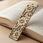 Wooden bookmark with floral design on an open book
