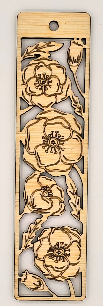 Wooden bookmark with floral cutout design on a plain background