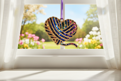 Decorative leaf-shaped ornament with colorful design on a white background