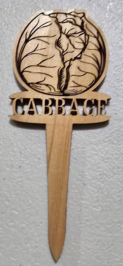 Wooden paddle with laser-cut design on a white surface