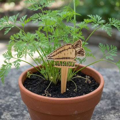 Wooden carrot-shaped tool on a light gray surface