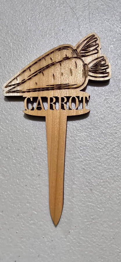 Wooden carrot-shaped tool on a light gray surface