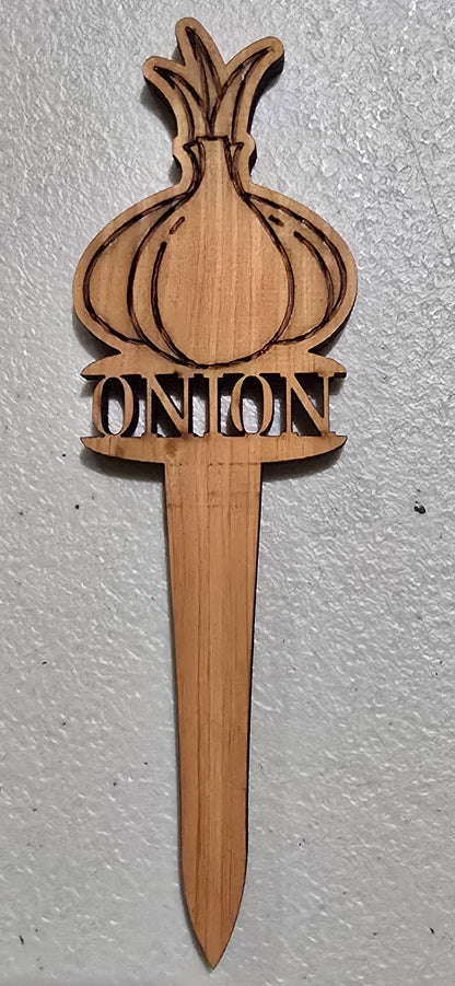 Wooden onion-shaped plant marker on a light gray surface