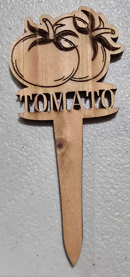 Wooden paddle with palm tree design and text on a light gray surface