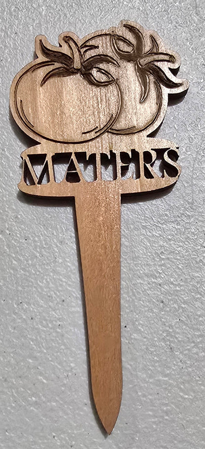 Wooden paddle with decorative design on a light gray background