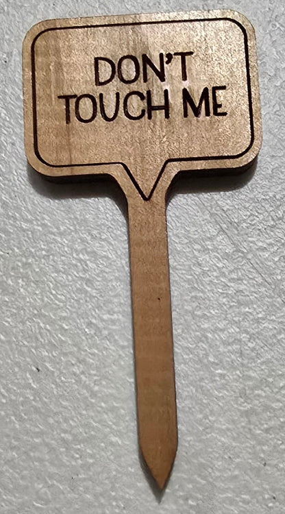 Wooden sign with 'Don't Touch Me' text on a light gray background