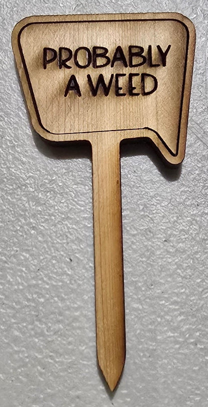 Metallic sign with 'PROBABLY A weed' text on a gray background