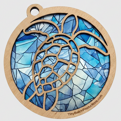 Decorative pendant with blue stained glass design on a white background
