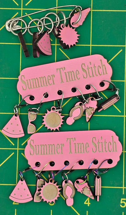 Pink and black sewing-themed cutouts on a green cutting mat with measurements.